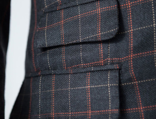 Close-up of a ticket pocket of a bespoke silk suit